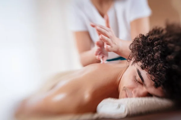 Young Man Enjoying Relaxing Back Massage Spa Salon — Stock Photo, Image