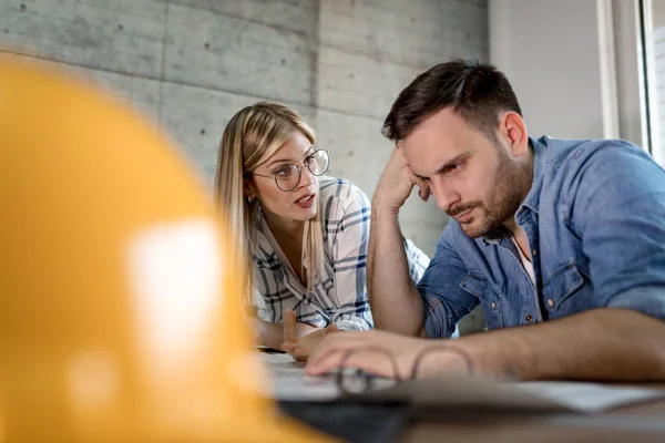 Young Architect Colleagues Analyzing Blueprints Office — Stock Photo, Image