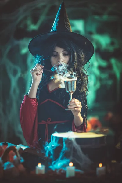 Young Witch Seriously Face Creepy Surroundings Smoky Green Background Holds — Stock Photo, Image