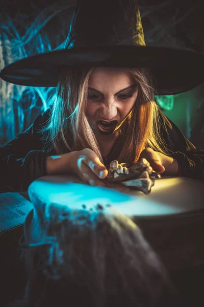 Young Angry Witch Awfully Face Tells Evil Words Putting Bones — Stock Photo, Image