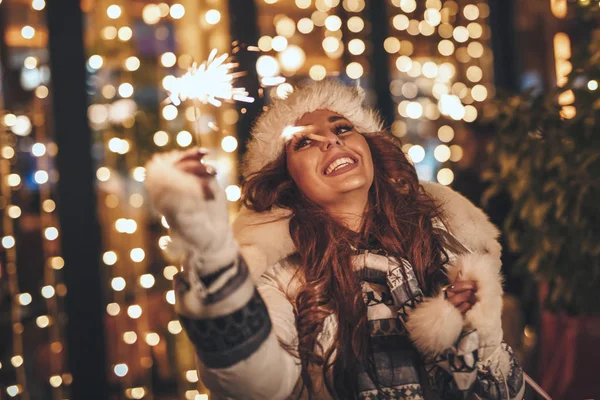 Cute Cheerful Girl Sparklers Enjoying Christmas Eve City Street Lot — стоковое фото