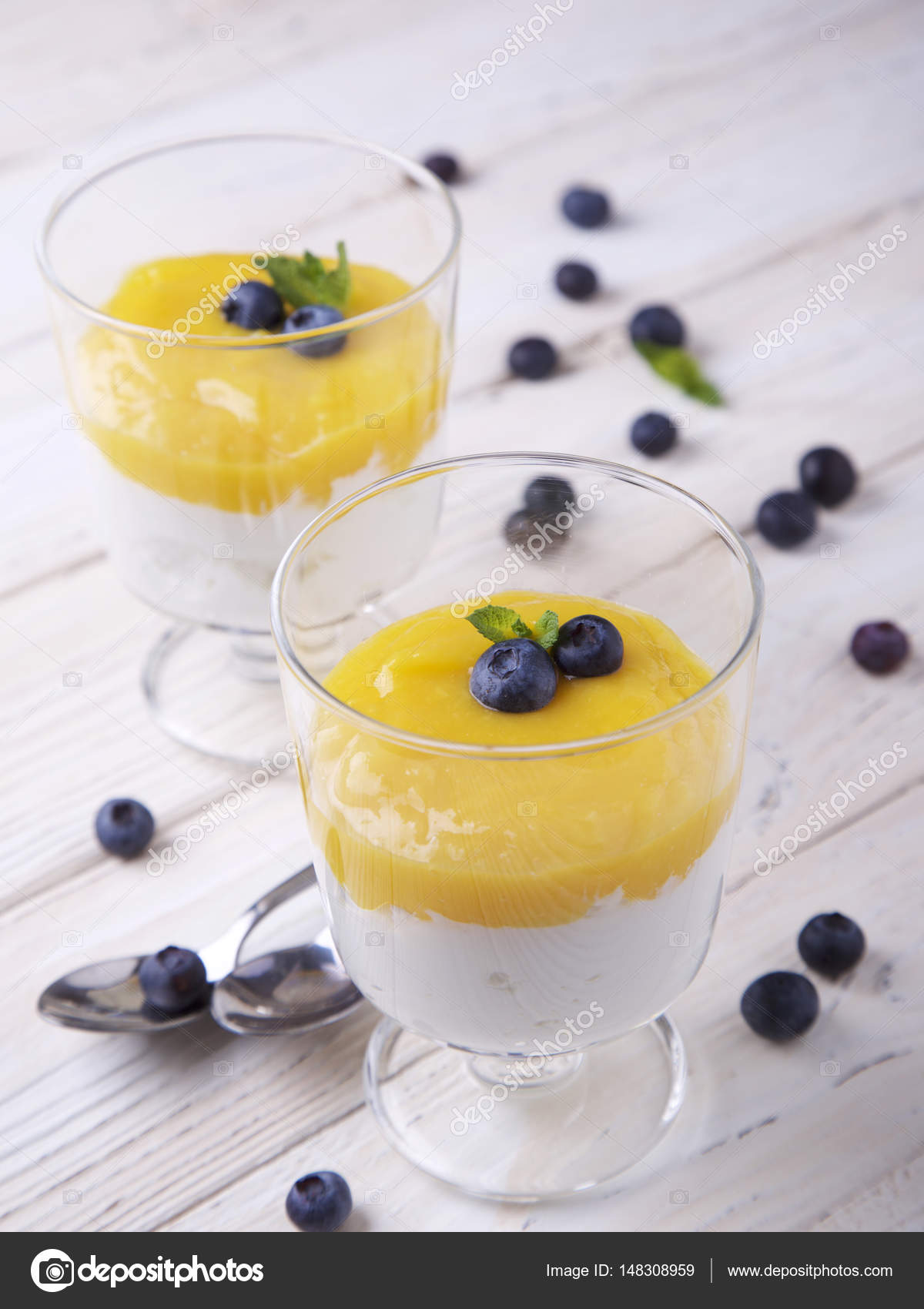 Cottage Cheese With Mango Puree And Blueberries Stock Photo