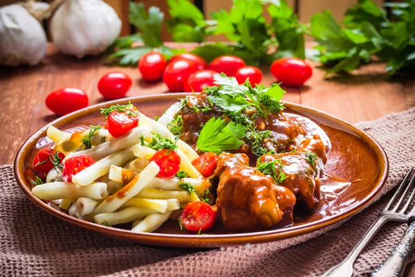 Chicken wings tomato sauce green beans rice — Stock Photo, Image