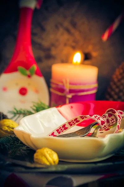 Festively decorated Christmas table tableware candles mood — Stock Photo, Image