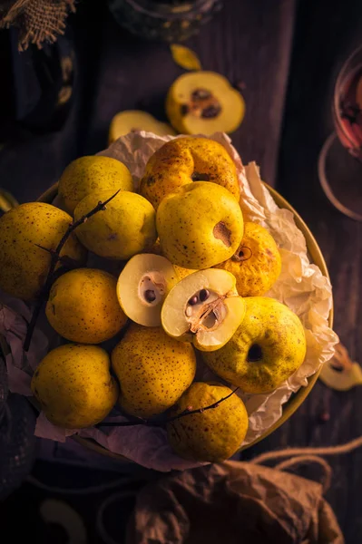 Fruits twigs quince wooden table — Stock Photo, Image