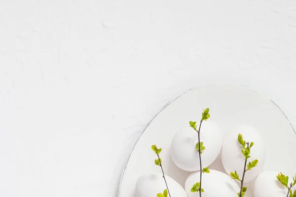 White eggs spring twigs platter — Stock Photo, Image