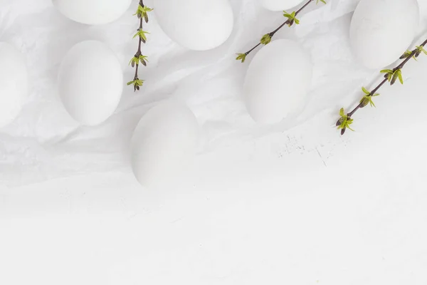 Easter background white eggs green spring twigs — Stock Photo, Image