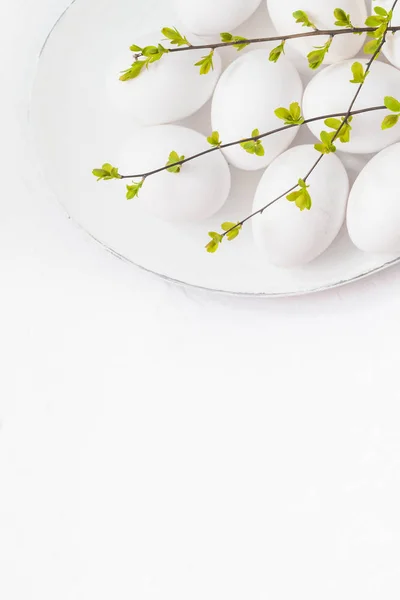 White eggs spring twigs platter — Stock Photo, Image