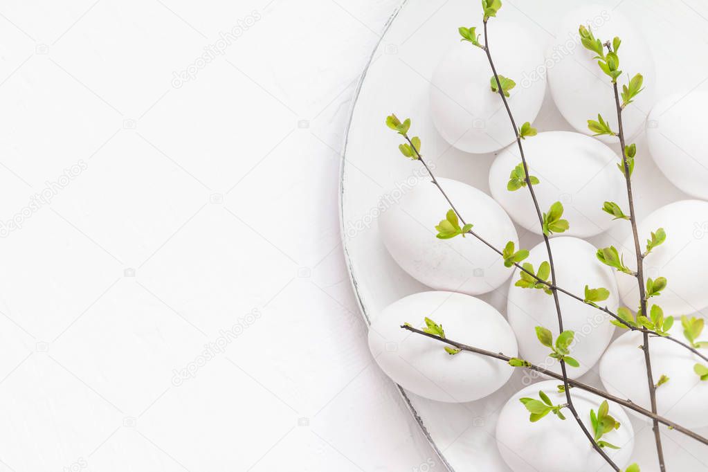 White eggs spring twigs platter