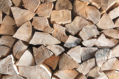 Firewood Dry firewood in a pile for furnace kindling clipart