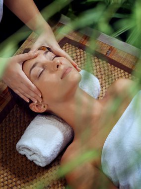 portrait of young beautiful woman in spa environment clipart
