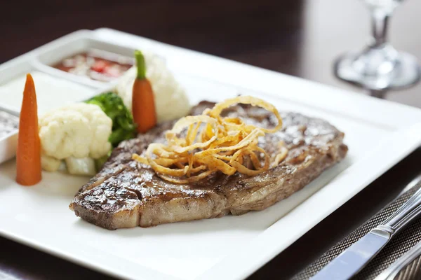 Fresh steak on color background — Stock Photo, Image