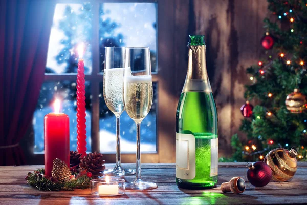 Close up view of two glasses with champagne and candles on color back — Stock Photo, Image