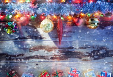 close up view of christmas tree toys  and gifts  on wooden back clipart