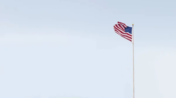 View of American flag on blue sky back. banner. lots of space for your text — Stock Photo, Image