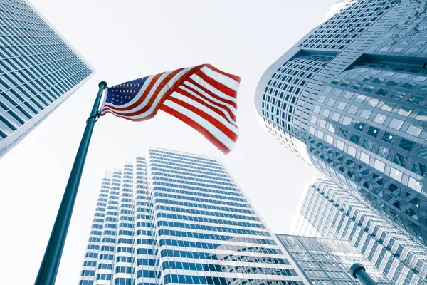 View of American flag on blue building background — Stock Photo, Image