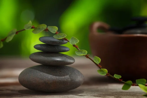 Close up view of gray stones and leaf on color back. — Stock Photo, Image