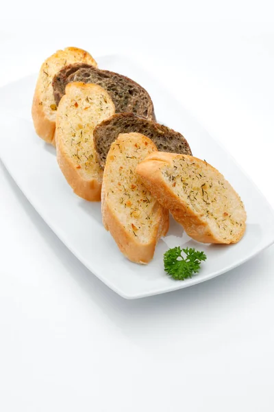 Close up view of some bread in plate   on whit back — Stock Photo, Image