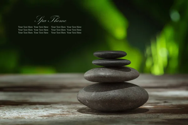 Close up view of gray stones and leaf on color back. — Stock Photo, Image