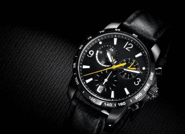 close up view of nice man's wrist watch on black background clipart