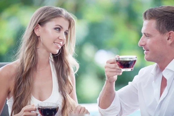 Portrait of nice young couple having breakfast in summer environment — Stock Photo, Image