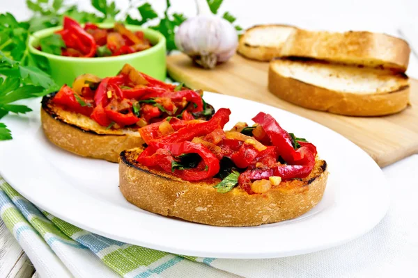 Bruschetta with vegetables in plate on light board — Stock Photo, Image