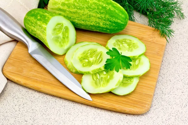 Cucumber with parsley on granite table — Stock Photo, Image