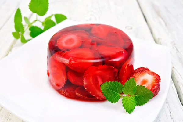 Jelly strawberry with mint on light board — Stock Photo, Image