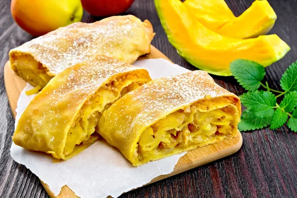 Strudel pumpkin and apple on board — Stock Photo, Image