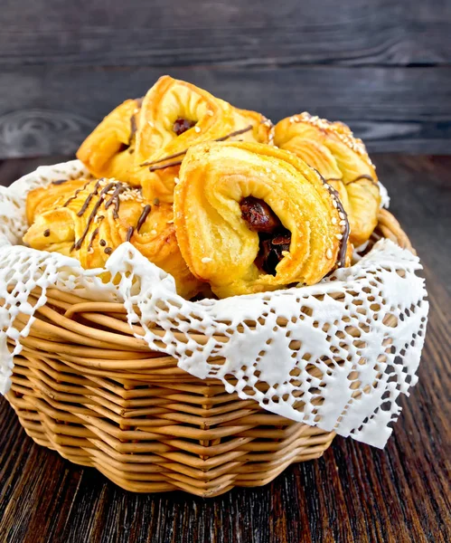 Cookies with dates in basket on board — Stock Photo, Image