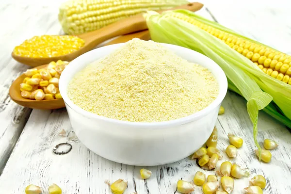 Flour corn in bowl on board — Stock Photo, Image