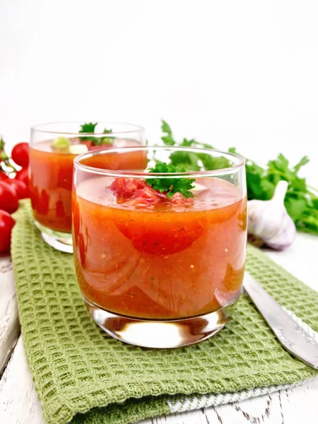 Soup tomato in two glasses with parsley on light board — Stock Photo, Image