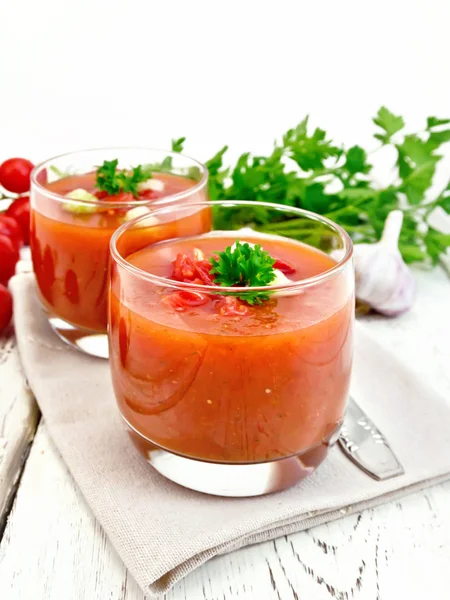 Soup tomato in two glasses with parsley on board — Stock Photo, Image