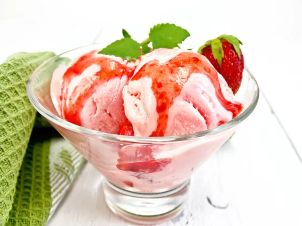 Ice cream strawberry with syrup in glass on light board — Stock Photo, Image