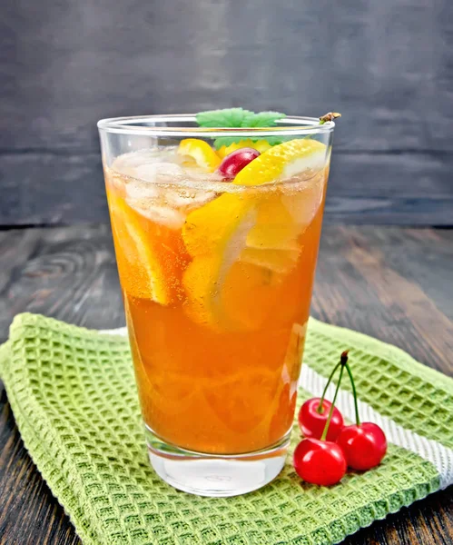 Lemonade cherry and orange in glassful on board — Stock Photo, Image