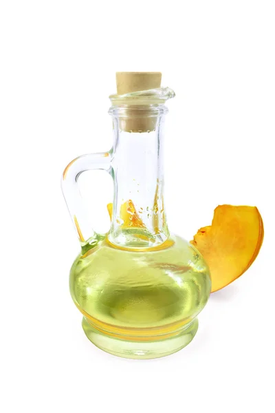 Oil pumpkin in decanter — Stock Photo, Image