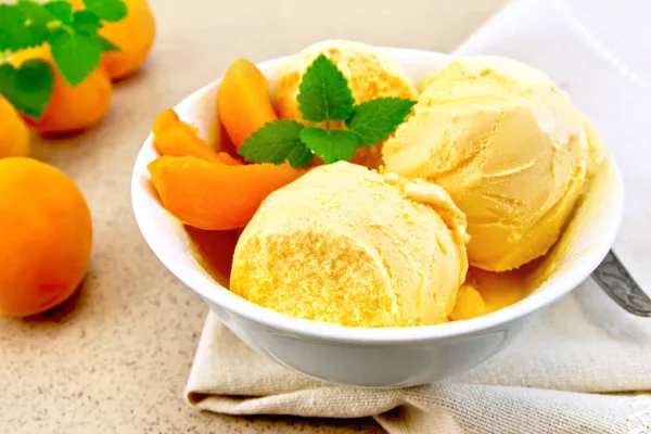 Ice cream apricot in bowl on napkin — Stock Photo, Image