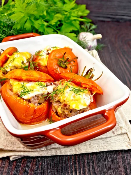 Tomatoes stuffed with rice and meat in brown brazier — Stock Photo, Image