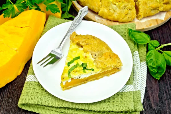 Pie of pumpkin and cheese in plate on napkin — Stock Photo, Image