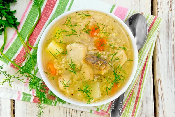 Soup fish with millet on board top — Stock Photo, Image