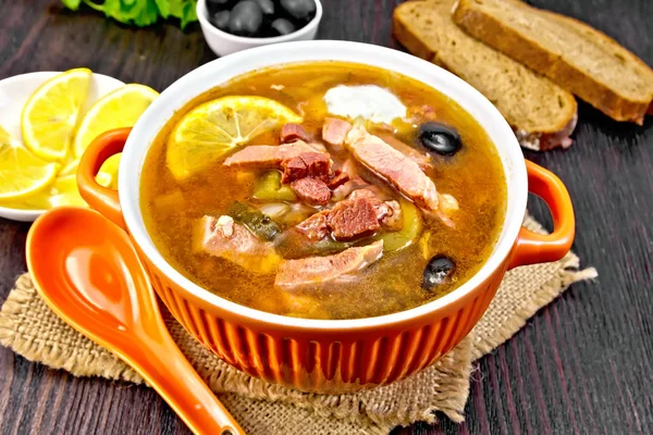 Solyanka in bowl on sackcloth — Stock Image Solyanka in bowl on sackcloth Stock Image