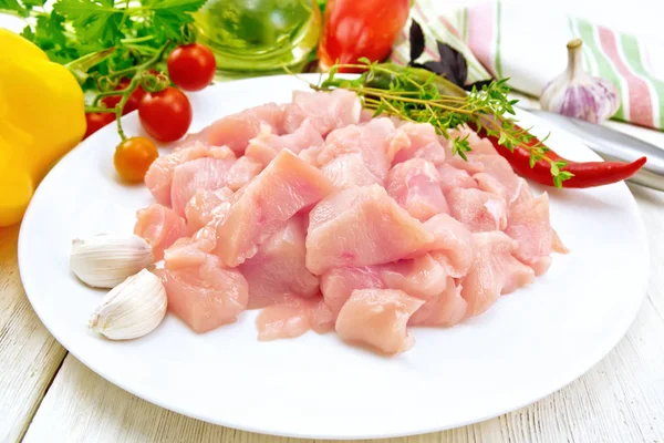 Chicken breast raw sliced in plate on light board — Stock Photo, Image