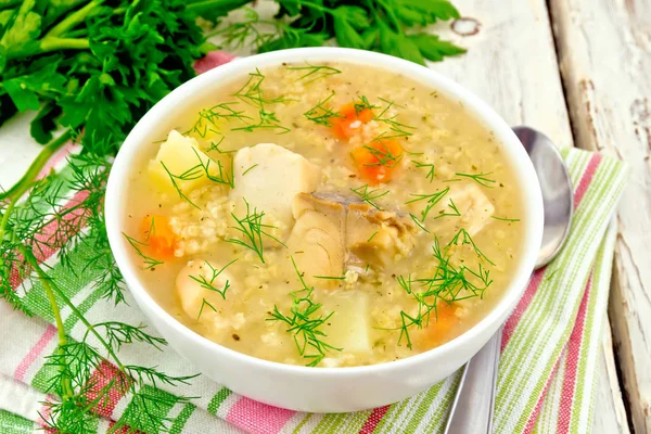 Soup fish with millet on white board — Stock Photo, Image