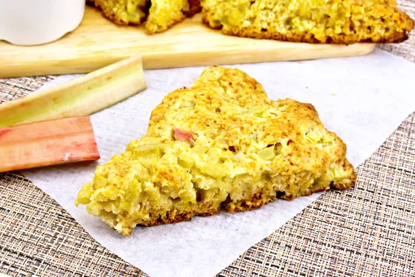 Scones with rhubarb on wattled napkin — Stock Photo, Image