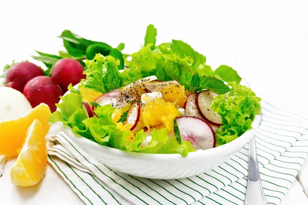 Salad of radish and orange with mint on white board — Stock Photo, Image