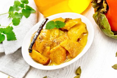 Persimmons baked with honey in dish on board
