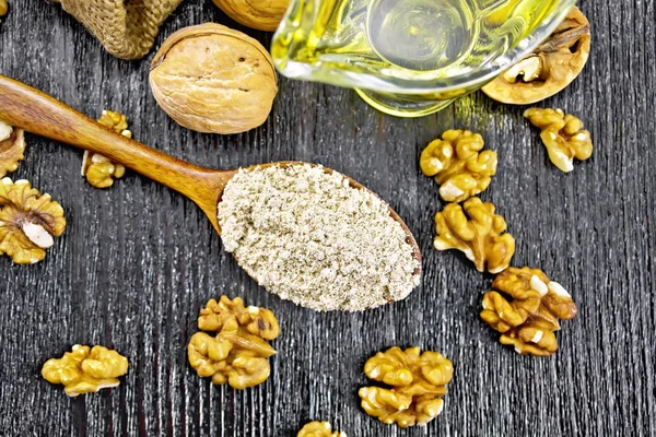 Flour walnut in spoon on board top — Stockfoto