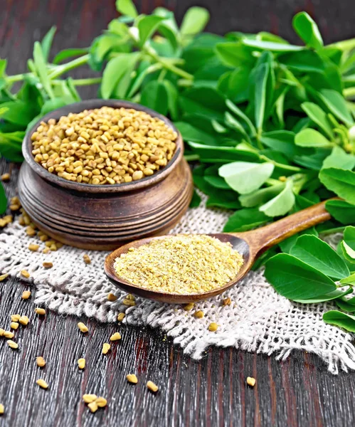 Ground Fenugreek Spoon Seeds Bowl Burlap Green Leaves Wooden Board — ストック写真