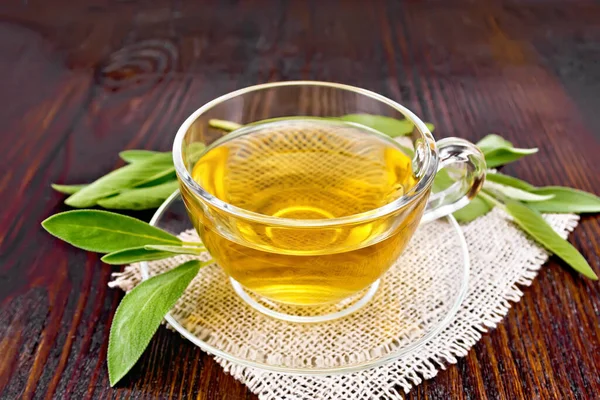 Herbal Tea Sage Glass Cup Burlap Napkin Wooden Board Backgroun — Stock Photo, Image