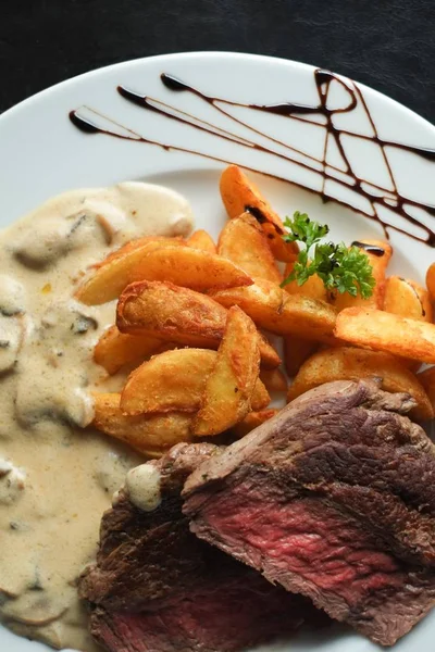 food photo beef steak with french fries and mushroom sauce